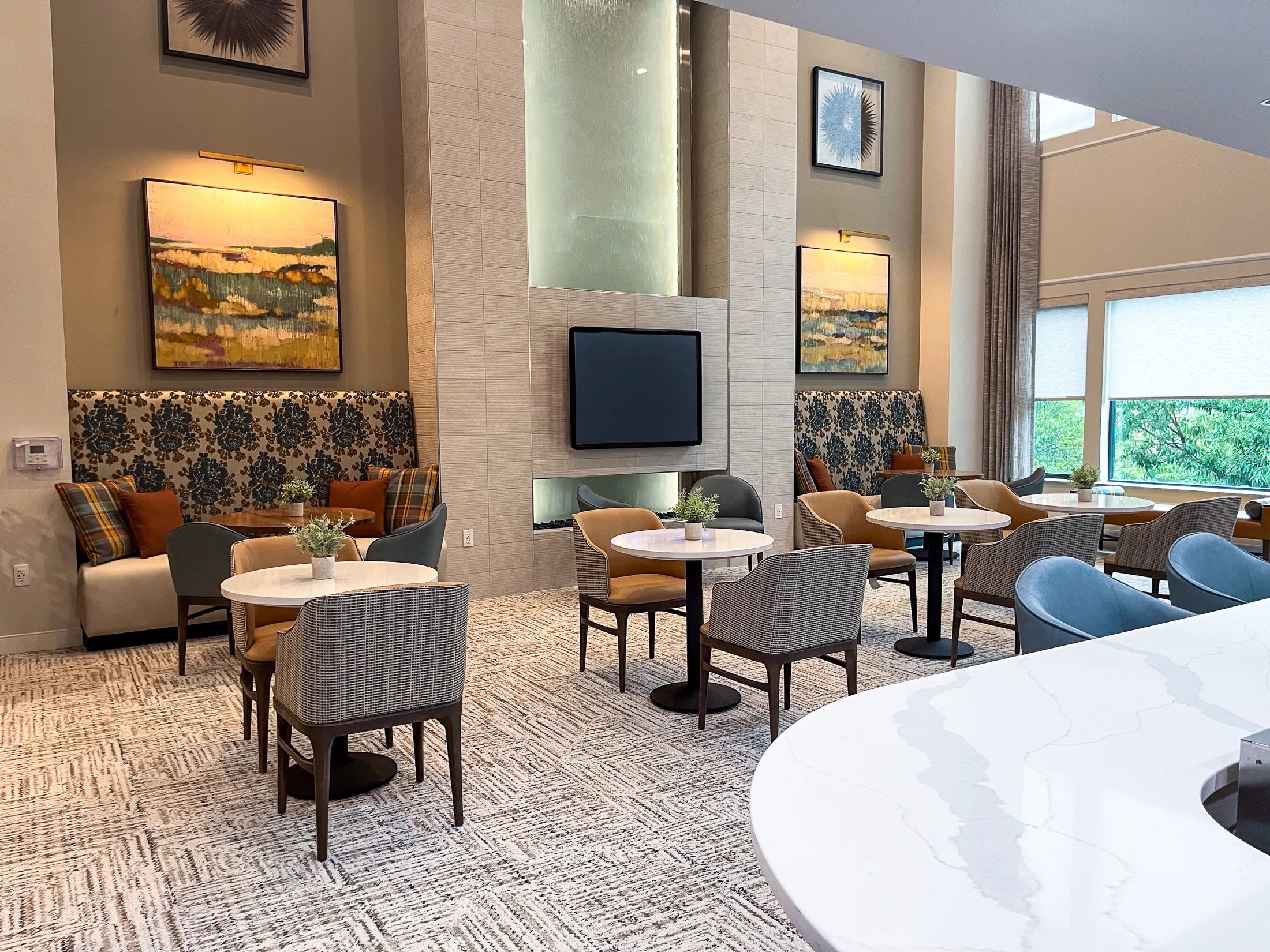 Double-height fireside lounge at Alate Old Towne