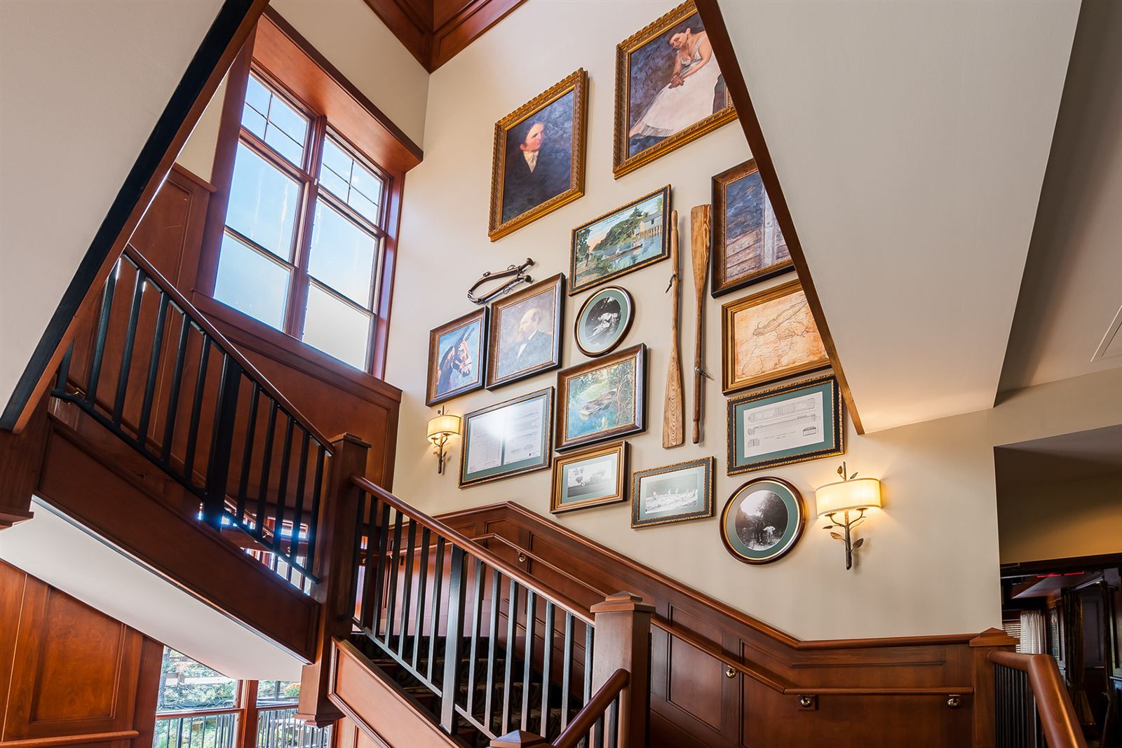 Grand staircase with gallery wall at LockKeepers