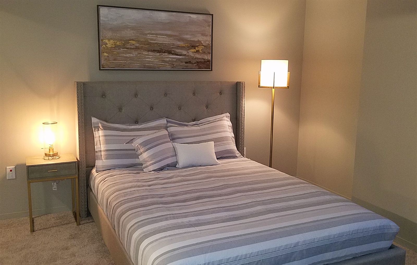 Primary bedroom at the Statler Model Suite
